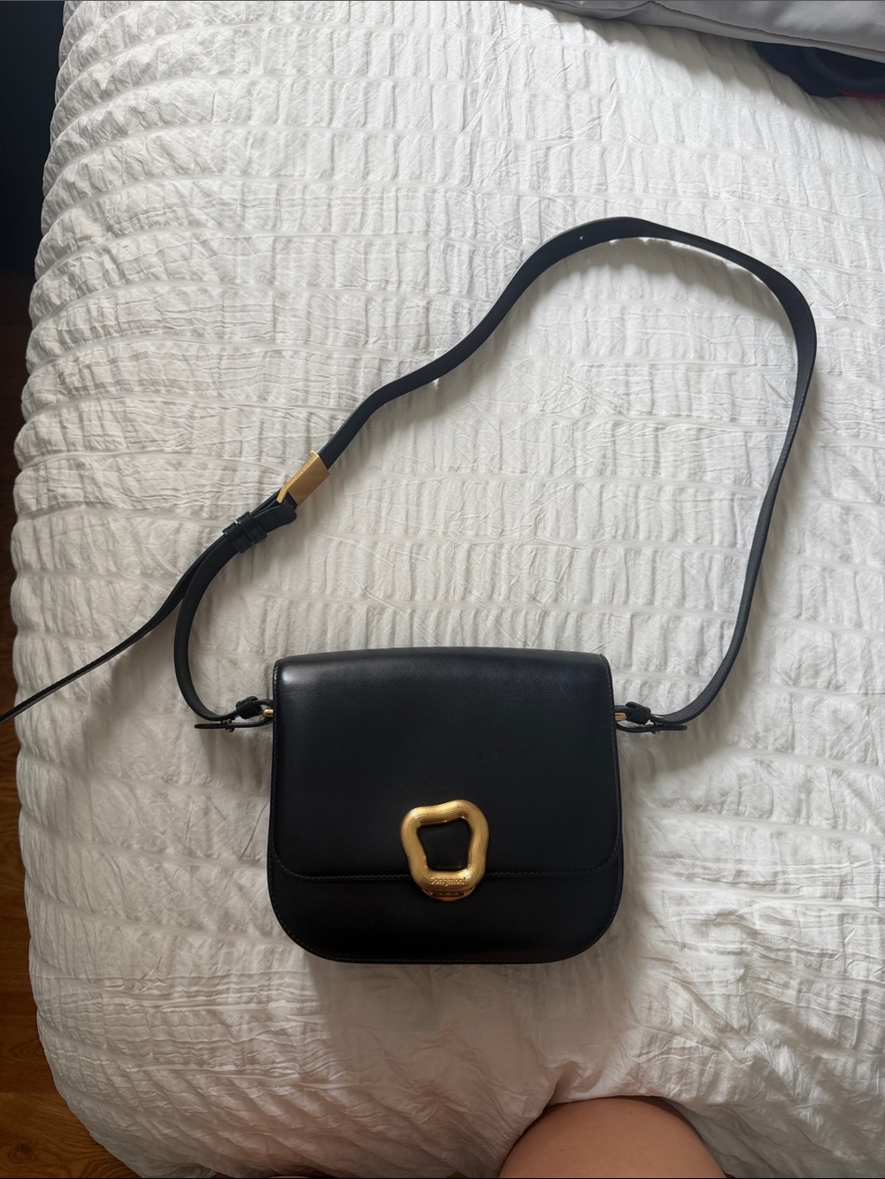 Songmont Black Leather Crossbody with Gold Accent